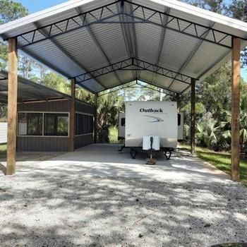 Rv Parking Pad Ideas, Diy Rv Covered Parking, Covered Rv Parking Home, Rv Port, Rv Shelter With Deck, Rv Covered Parking, Small Rv Park Design Plans, Rv Building Rv Garage, Rv Carport With Storage Room