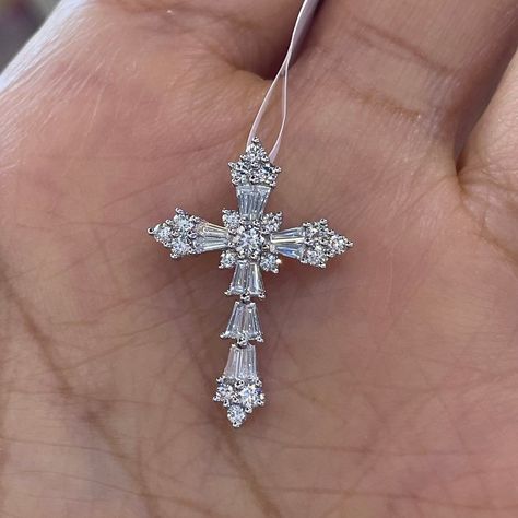 "Beautiful Diamond Cross Pendant set with baguette and round brilliant cut diamonds.  Good Quality Diamonds, no black carbon spot when viewed under a magnifying glass.  The diamonds are very sparkling.  Excellent craftsmanship, all diamonds are set nice and smooth.   Lays nicely on the neck, it won't flip around.  Not too big or small, just the right size.   Cross measures about  23.8 x 16.8.  Strong white gold link chain shown available for purchase.  Available in 18K white and yellow gold.  Genuine Round Brilliant Cut Diamonds Total weight: 0.70 Carats  Baguettes: 0.31 carats  Rounds: 0.39 carats Clarity: VS/SI Color: F Solid 18K white gold 1.72 grams  14K white gold chain 1.95 grams 18\" Comes with gift box * We have been in the wholesale Jewelry business for over 30 years serving the c Beautiful Cross Necklace, Cross Diamond Necklace, Silver Diamond Cross Necklace, Diamond Cross Necklace, Catholic Cross, Jewelry Cross, Expensive Jewelry Luxury, Gold Link Chain, Gold Link