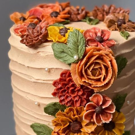 Chaimaa Creates | Cake Artist on Instagram: "Every September I take a trip down memory lane and look over all the autumnal cakes I’ve made in the past. I didn’t make many last year but hope to create more this year. Autumnal colours like burgundy and burnt orange are some of my favourite colours to work with.

Autumn sun is here, I am hanging on to the blue skies & sun for as long as I can🩵🍂🧡🍁

.
.
.
.
.
.
.
.

 #buttercreamart #mehendicake #flowercake  #paintingvideo #cakepainting #roses #pinkflowerart #edibleart #cakesofig #cakeart #cakestyle #flowercake #eastlondonbaker #london #cake #florals #cakedecorating #cakelove #flowerpiping #cupcakedecoration #autumninspired #hackneycakes #feedfeedbaking #cakepainting #autumncakes #flowerpiping #sunflowercake" Fall Flower Cake Decorating, Terra Cotta Wedding Cake, Fall Flower Cake, Cake Florals, Terra Cotta Wedding, Fall Themes, Autumnal Colours, London Cake, Autumn Sun