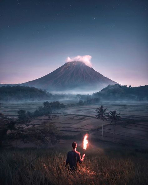 Now Discovering Mount Agung in Bali, Indonesia with @visualsofjulius. Mount Agung or Gunung Agung is a volcano in Bali, Indonesia, southeast of Mt. Batur volcano. It dominates the surrounding area, influencing the climate - especially rainfall patterns. From a distance, the mountain appears to be perfectly conical. World View, Beautiful Mountains, Photo Location, Nature Photos, Volcano, Vacation Trips, Art Day, Cool Pictures, Tourism