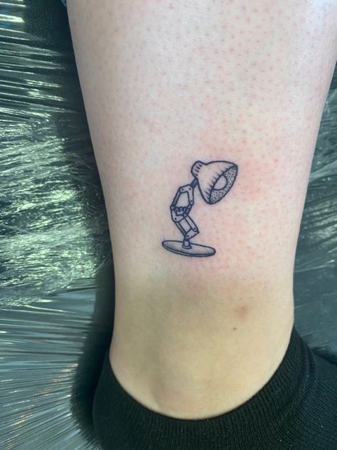 Small Movie Themed Tattoos, Simple Toy Story Tattoo, Tattoo From Movies, Childhood Movie Tattoos, Disney Pixar Tattoo Ideas, Planet Express Tattoo, Tattoo Cartoon Ideas, Funny Disney Tattoos, Minimalist Movie Tattoo