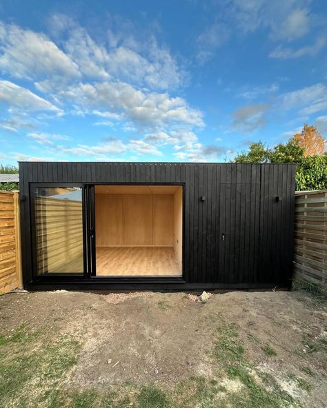 This is a recently completed OKOPOD home office with integrated shed. The shed has a fully clad door which is designed to blend in with the rest of the shou Sugi ban cladding. Contact us for more information info@okopod.com #gardenroom #gardenoffice #gardenpod #gardenretreat #gardenstudio #gardenhangout #homeoffice #office #wfh #workfromhome #prefab #annexe #annex #tinyhome #smallhome #tinyliving #shousugiban #okopod Garden Room Black Cladding, Black Backyard Shed, Black Garden Cabin, Garden Office Pod, Home Gym Shed Garden Office, Garden Pods, Modern Shed, Home Bar Rooms, Backyard Studio