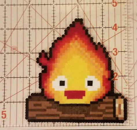 Howel's moving Castle's Calcifer made out of perler beads. Calcifer Perler Beads, Howls Moving Castle Perler, Howls Moving Castle Perler Bead, Calcifer Perler, Howls Moving Castle Pixel Art, Calcifer Pixel Art, Alpha Crochet, Anime Perler, Perler Creations