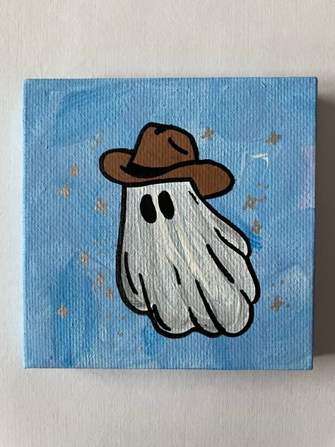 "3\"x3\" Blue Hand Painted Sparkle Halloween Ghost with Cowboy Hat Canvas Painting This small ghost painting is the perfect addition to your fall/Halloween decor.  Hand painted on a 3\"x3\" canvas with acrylic paint, each painting is one of a kind.  A great gift for a friend or family member or perfect just for you!" Ghost With Cowboy Hat, Ghost Paintings, Ghost Halloween Decor, Halloween Canvas Paintings, Western Ghost, Art Mini Toile, Halloween Canvas Art, Cute Easy Paintings, Ghost Painting