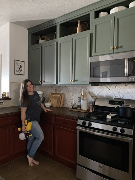 I Painted My Kitchen Cabinets Green! Painted Kitchen Cabinets Before And After Green, Half Wood Half Painted Cabinets, Olive Green Cabinet Colors, Green Base Kitchen Cabinets, Painted Upper Kitchen Cabinets, Kitchen Cabinet Color With Black Countertops, Dark Green Cabinets Black Hardware, Artichoke Kitchen Cabinets, Painted Vinyl Kitchen Cabinets