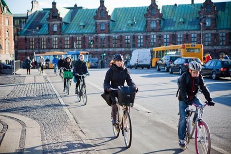 Cyclists use a cycle lane to travel past the Copenhagen Stock Exchange, center, in Copenhagen, Denmark Copper Roof, Bike Lane, Standing Seam, Trail Blazers, Dream City, Copenhagen Denmark, Clean Energy, High Life, Stock Exchange