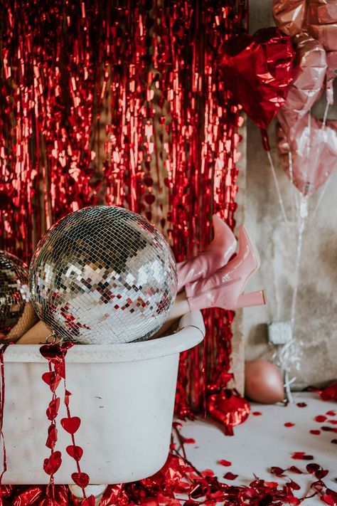 Disco ball in bathtub with women's legs right next to it, disco ball trend, valentines day aesthetic Valentines Day Background Photography, Disco Valentines Day Photoshoot, Disco Couple Photoshoot, Disco Ball Valentines, Valentine Studio Photoshoot, Bestie Valentines Day Photoshoot, Disco Valentines Day, Valentine’s Day Photoshoot Couples, Valentines Photoshoot Couples