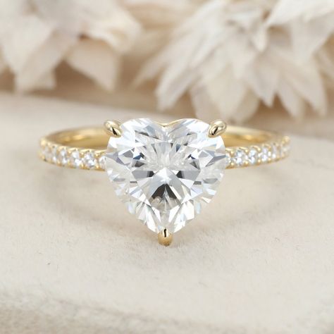 Indulge in captivating brilliance with our Pave Set Side-Stone 3 Carat Heart Cut Moissanite Engagement Ring, elegantly crafted in 14K Yellow Gold. This stunning piece captures the essence of eternal love, promising a lifetime of happiness and romance. Heart Shaped Diamond Engagement Ring, Heart Diamond Engagement Ring, Heart Cut Engagement Ring, Cute Promise Rings, Heart Shaped Diamond Ring, Heart Shaped Engagement Rings, Radiant Cut Rings, Heart Engagement Rings, Diamond Heart Ring