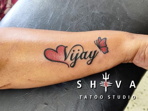 Vijay Name Tattoo, Ajay Name Tattoo, Lettering Idea, V Letter Images, Cross With Wings Tattoo, Name Tattoo On Hand, Tattoo Banner, Mom Dad Tattoo Designs, Side Wrist Tattoos