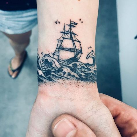 Battleship Tattoo Ideas, Small Nautical Tattoo Mens, Ocean Themed Hand Tattoos, Underwater Shipwreck Tattoo, Ocean Wrist Tattoo, Skull Island Tattoo, Small Pirate Ship Tattoo, Nautical Tattoo Ideas, Ship Tattoo Design