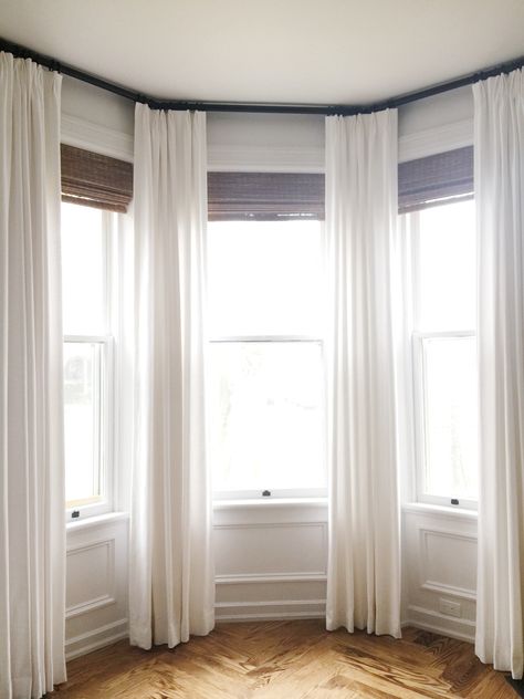 Curtains Around Bay Window, White Curtains Bay Window, Bay Window Sheer Curtain Ideas, Curtain Bay Window Bedroom, Long Curtains Bay Window, Curtains On Stairway Window, Drapes On Bay Window, Bay Curtains Bedroom, Tall Bay Window Ideas