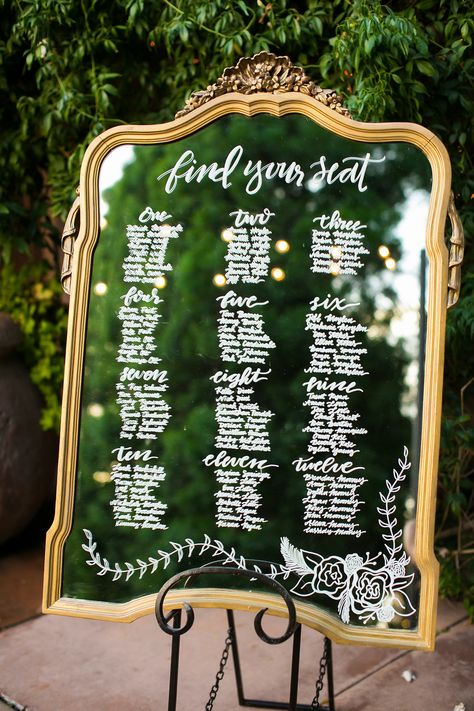 Gold mirror seating chart. Glass seating chart at Franciscan Garden wedding by Lucky Day Events Co. Creative Table Assignments Wedding, Mirror Signage, Affordable Wedding Decorations, Seating Chart Wedding Diy, Mirror Seating Chart, Wedding Table Seating Chart, Mirror Wedding, Wedding Table Seating, Table Seating Chart