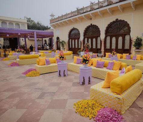 Sharvi and Ishaan’s Haldi decor, a perfect blend of tradition and modern flair at @thealsisarnahargarh 💛💜 Photos- @thewhitebox.in #alsisarmahal #alsisarnahargarh #nahargarhwedding #alsisarmahal #decorbykomal #inspiredesign #weddingdecoration #shaadisaga #decorbykomal #decorationinspo #indianwedding #luxurywedding #grandwedding #goaweddingplanner #goaweddingdecor #weddingdecorator #weddingsofinstagram # #floraldesign #flowerdecoration #weddingdecorideas @fabwedding @weddingz.in @shaadidukaa... Haldi Seating, Goa Wedding, Haldi Decor, Wedding 2025, Haldi Ceremony, Wedding Decor Inspiration, Prom Night, Hanging Lanterns, Event Management