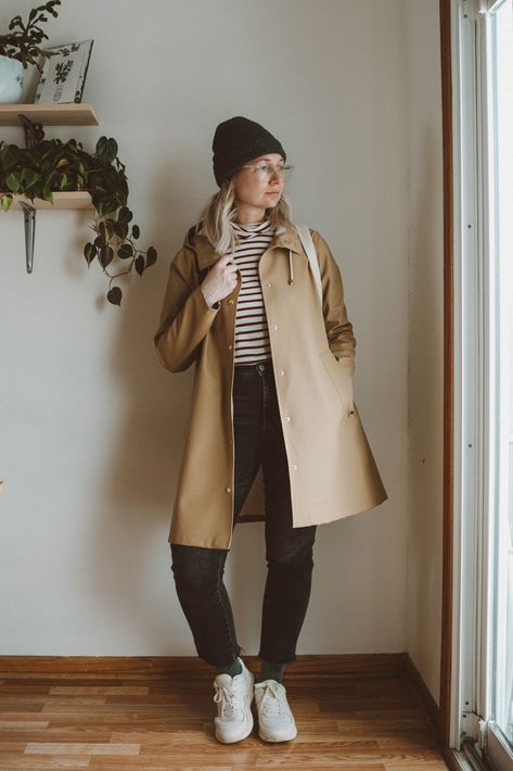 Stutterheim Raincoat Review + 5 Styling Ideas | Truncation    #stutterheimraincoatreview #everlanesneakers #gapdenim #stripedturtleneck #madewellstyle Outfit With Raincoat, Stutterheim Raincoat Women, Rains Raincoat Outfit, Stutterheim Raincoat Outfit, Khaki Raincoat Outfit, Styling A Raincoat, Raincoat Outfit Woman, Tan Rain Coat Outfit, Cute Rain Coats For Women