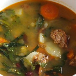 Kale simmers with sausage, garlic, onions and more for the Best Portuguese Kale Soup recipe. Portugese Kale Soup, Portuguese Kale Soup, Sausage Beans, Portuguese Soup, Kale Sausage, Low Carb Vegetable Soup, Kale Vegetable, Curly Kale, Kale Soup Recipes