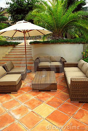 Patio of a villa by Elena Elisseeva, via Dreamstime Sand Porcelain Tile, Wood Deck Tiles, Sunken Patio, Natural Tile, White Porcelain Tile, Saltillo Tile, Beige Tile, Outdoor Wicker Furniture, Porcelain Wall Tile