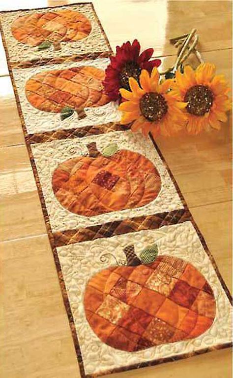 Get ready for autumn with this cute harvest table runner! Use your favorite orange scraps to complete this cute project. This sophisticated fall decoration Patchwork Pumpkin, Pumpkin Table Runner, Quilted Table Runners Patterns, Quilted Table Toppers, Holiday Quilts, Fall Quilts, Halloween Quilts, Table Runner And Placemats, Table Runner Pattern