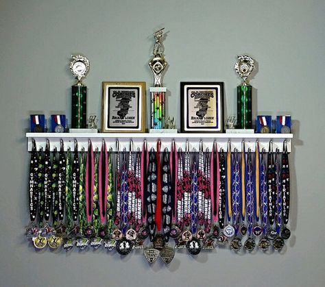 SHIPS IN 1-3 BUSINESS DAYS! The Premier Award Display Rack for all your hard-earned Award Medals, Trophies, and Plaques! All 4 Foot Award Medal Display Racks include: 37 pegs to accommodate Lanyard Ribbon Medals; 3 1/2 Trophy Shelf for Trophy Display; Trophy Shelf includes a Dual Medals And Trophies, Medal Hanger Display, Trophy Shelf, Soccer Room, Trophy Display, Ribbon Display, Sport Bedroom, Baseball Room, Dance Rooms