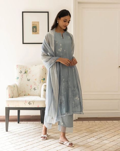 Sidle into summer's gentle touch with our Powder Blue Floral Kurta Set. Its delicate floral prints and subtle tone-on-tone applique detail evoke a serene, breezy vibe. Paired with matching pants featuring a sheer hemline and a panelled dupatta with a linear print, it's the epitome of effortless summer elegance Shop now at vaayu.co.in #VaayuClothing #Summer24 #ShopNow Pretty Dresses Casual, Kurta Pant Set, Chanderi Suits, Fashion Sketches Dresses, A Line Kurta, Desi Girl, Special Dresses, Kurta With Pants, Matching Pants