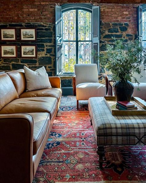 Liz Mearns Interior Designer on Instagram: "I’m back at work after an amazing and inspiring few days in Europe, and I’m excited to share the office/den from the stunning Georgetown project we finished last year.   This might just be the coolest office ever! Nestled in a nearly 200-year-old stone-walled cellar with brick floors, this room stays cool on even the hottest DC summer days and exudes a swanky speakeasy vibe at night. Huge arched windows face the street, and a side door provides garden access giving the space amazing natural light. The wet bar, leather sofa, club chairs, and antique Persian rug create the clubby layered look we were after. .  If you swipe you can see the desk is actually behind the sofa. I often consider placing a desk as a sofa table if there is room because it c Caramel Leather Sofa, Chesterfield Living Room, Cozy Christmas Living Room, Holiday Living Room, Farmhouse Style Furniture, Elegant Living Room Design, Vintage Industrial Decor, Designer Profile, Brick Flooring