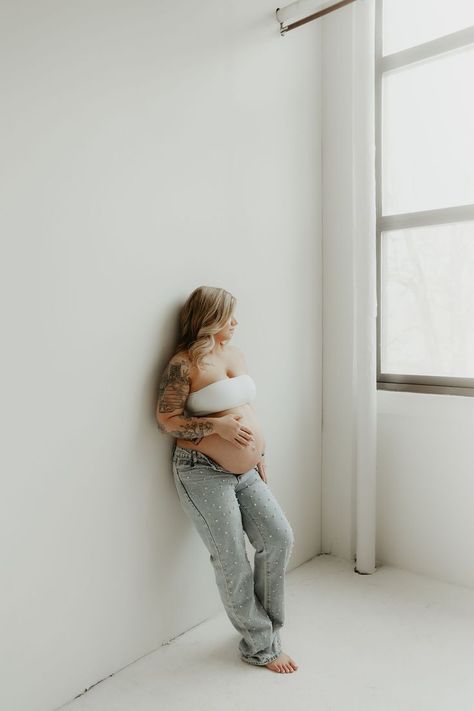 Maternity Photography. In studio maternity photography. Maternity photography poses. Maternity photography ideas. White maternity bra and sparkle jeans photography session outfit. Tattooed mom to be. Mother to be. Baby on the way. Summer 2024 baby. Studio maternity photography. Summer nails. Blonde curly hair. Happy mom to be. Natural light photography. Maternity Photography Summer, Maternity Photography In Studio, Maternity Hair, Jeans Photography, Studio Maternity Photography, Photography In Studio, Tattooed Mom, Studio Maternity Shoot, Maternity Photography Ideas