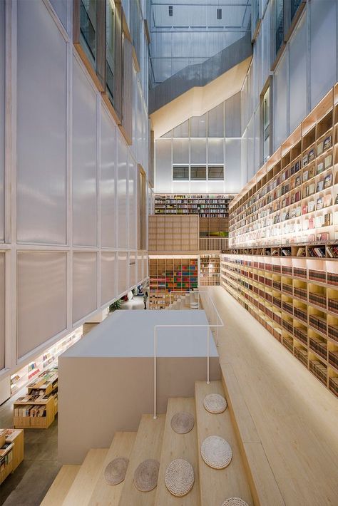 "We embedded a bookstore into the space of two atriums. It links up the 1F and 2F floors through different levels of stairs, hence forming a vertical circulation route to walk around and explore between both atriums while creating rich, playful visual effects and experiences within the limited space."

Learn more at Architonic.com

#architonic #architecture #design #interior #interiordesign #bookstore #bookstoreinterior #shopinterior #interiorlover Library Architecture, Flexible Space, Folder Design, Architecture Concept Drawings, Interior Stairs, Library Design, Space Architecture, Structure Design, Shop Interiors