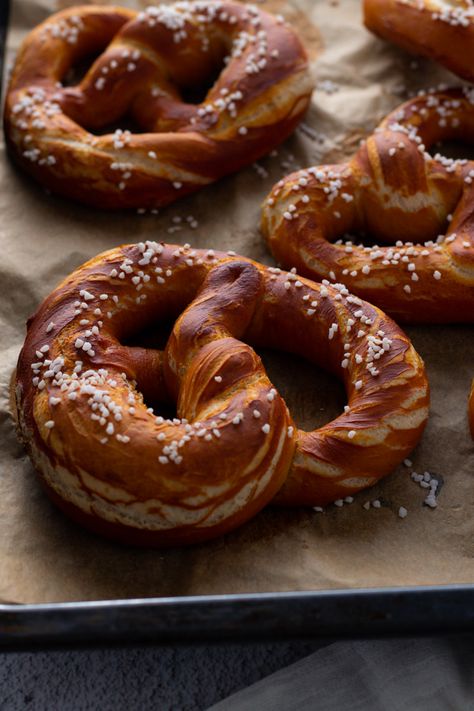 The cornerstone of the Bavarian bakery, soft pretzels are easy and fun to make at home. Make sure to check out the photos to see how to tie them! Hot Pretzels, Oktoberfest Recipes, German Pastries, Bavarian Pretzel, German Bakery, Baked Pretzels, Pretzel Dough, Pretzel Shape, German Bread