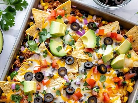 Easy Sheet Pan Nachos Recipe: A Deliciously Loaded Party Favorite - NewsBreak Nachos With Refried Beans, Easy Sheet Pan Nachos, Sheet Pan Nachos Recipe, Homemade Chili Beans, Cheesy Grits Recipe, Fried Cheese Bites, Sheet Pan Nachos, Pan Nachos, Sliders Recipes Chicken