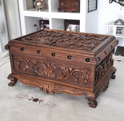 This amazing jewelry wooden box with lock is carved from walnut tree. Inside the jewelry box, bottom is covered by a claret velvet. At the rear corner, there is a hidden key pocket with camouflaged lid. It is totally a wood artwork for your pleasure. DIMENSIONS: Width 12.6 inches (32 cm) Depth 9 inches (23 cm) Height 6.1 inches (15.5) Inner Dimensions: 10.2x7x3.5 inches (26x17x9 cm) (The volume inside the lid is not included) Please visit our store to see all alternatives that you would like👇 h Jewerly Boxes Diy Wooden, Cool Wooden Boxes, Hidden Jewelry Boxes, Antique Jewelry Box Wood, Wood Jewelry Box Ideas, Wooden Treasure Chest, Jewelry Box Wood, Engraved Jewelry Box, Custom Wooden Boxes