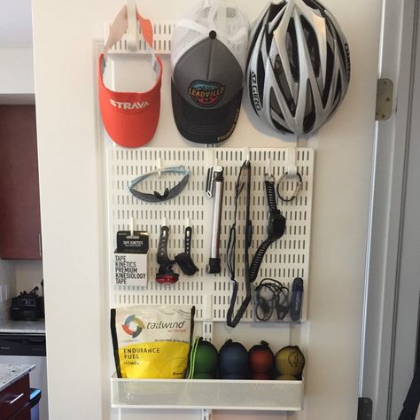 How I organize my running, cycling and swimming gear on the back of one door. | by Christen Dybenko | Medium Workout Gear Storage, Bike Gear Storage, Cycling Gear Storage, Bicycle Storage Rack, Running Room, Closet Organisation, Gear Wall, Gear Room, Cycle Storage