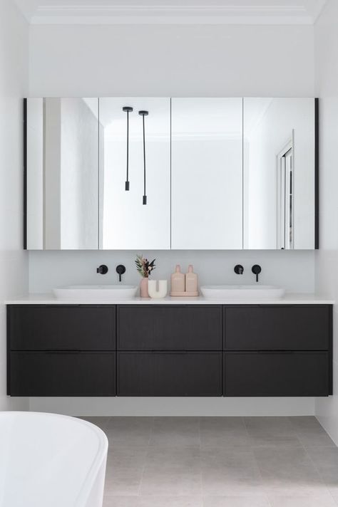 A custom floating vanity with his and her semi-inset basins and mirrored cabinet with hidden PowerPoints for practicality. Floating Bathroom Cabinets Modern, Ensuite Sink Ideas, Floating Black Vanity, Gray Floating Vanity Bathroom, Vanity In Alcove, Black Double Vanity, Vanity Floating, Floating Cabinet Bathroom, Floating Double Sink Vanity