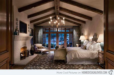 Bedrooms With Cathedral and Vaulted Ceilings | Home Design Lover.  Higgins Architects This bedroom is 17′x22″ and the ceiling height at the beam is approximately 11′-0″. The cathedral ceiling with exposed beam added a rustic appeal to the space. Romantic Bedroom Design, Design Seed, Mediterranean Bedroom, Bedroom Fireplace, Romantic Bedroom, Dreamy Bedrooms, The Ceiling, Remodel Bedroom, Master Bedrooms Decor