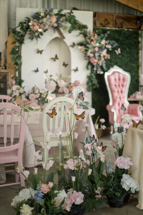 Butterfly-themed bridal shower setup with pastel chairs, pink flowers, and butterfly accents Rose Garden Bridal Shower Party Ideas, Fairy Themed Bridal Shower Ideas, He Gives Her Butterflies Bridal, Wedding Shower Butterfly Theme, Enchanted Garden Bridal Shower Theme, Pink And Green Bridal Shower, Fairy Bridal Shower Ideas, He Gives Me Butterflies Shower Theme, Butterfly Wedding Shower Theme