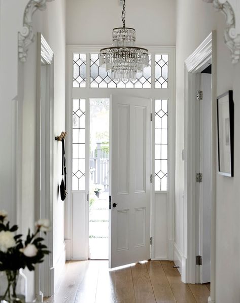 While the exterior facing is painted a bold black, the interior side of the front door is a calming white. Door and side panels custom-made by Steptoe's Renovation Supplies. Victorian Front Doors, Front Door Ideas, Queenslander House, Front Door Inspiration, British Homes, Front Door Styles, Kerb Appeal, Beautiful Front Doors, House Gate