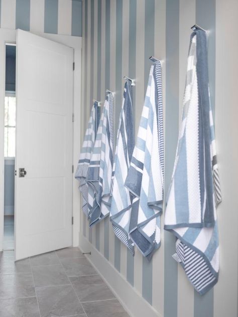 Blue Trim Bathroom, Blue Beach House Interiors, Cabana Bathroom Ideas, Pool House Bathroom Ideas, Striped Bathroom Walls, Hamptons Wallpaper, Cottage Basement, Cabana Bathroom, Pool House Bathroom