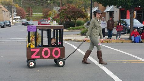 Zoo cage (built over wagon) with a Lion, Gorilla, and Zoo Keeper Wagon Cage For Halloween, Zoo Costumes For Family, Zoo Halloween Costumes, Family Zoo Costumes, Zoo Family Halloween Costume, Family Zoo Animal Costumes, Zoo Animals Halloween Costumes, Zoo Theme Halloween Costumes, Zoo Keeper Costume Family