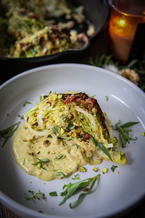 Elevate your winter dining experience with Cozy Roasted Cabbage Steaks, featuring a luscious pistachio cream sauce and bites of crispy prosciutto. A perfect blend of warmth and sophistication, this recipe is crafted to nourish both the body and soul during the chilly months. Winter Cabbage Recipes, Cabbage Steak, Roasted Cabbage Steaks, Crispy Prosciutto, Cabbage Steaks, Starch Solution, Cream Sauce Recipes, Roasted Cabbage, Pistachio Cream