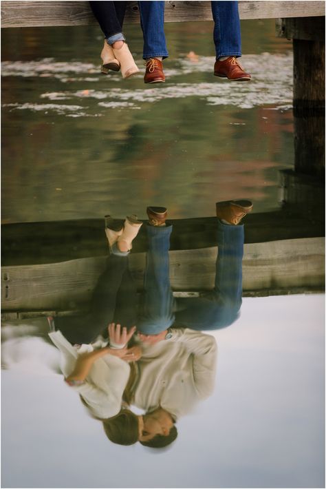 Creative engagement photo ideas sitting on a dock with a reflection on the water in Knoxville TN. Engagement Photo Water, Engagement Photos Funny Creative, Fall Inspired Engagement Photos, Dockside Engagement Photos, Lake Dock Engagement Pictures, Kayak Engagement Photos, Family Photos On Dock, Couples Photos By Lake, Lake Photo Shoot Ideas