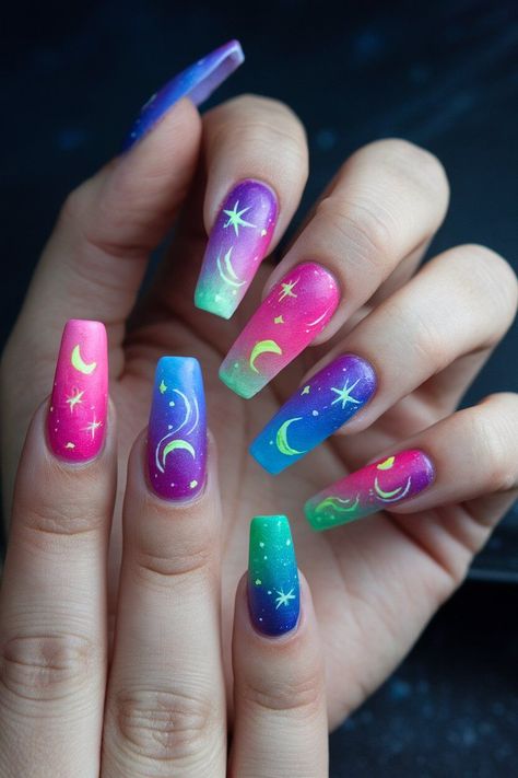 The photo shows a hand with medium-length coffin-shaped nails painted in bright neon colours, including green, pink, and orange. Some nails feature subtle swirl designs, creating a vibrant and playful look. Neon Glow Nails, Neon Rainbow Nails, Rainbow Nail Art Designs, Tropical Nail Designs, Bright Nail Designs, Neon Nail Art, Palm Tree Nails, Evil Eye Nails, Neon Nail Designs