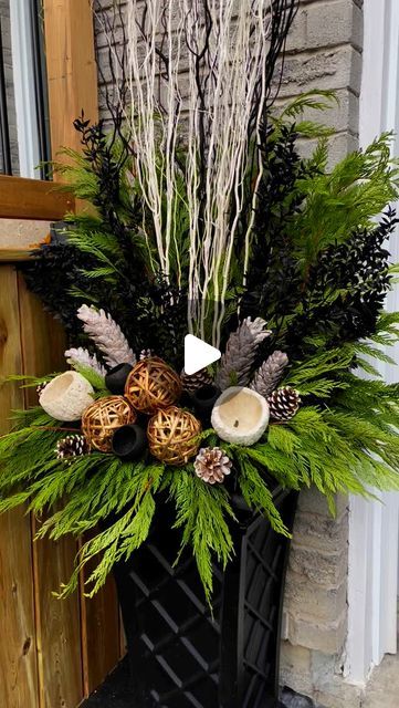 Vanessa Monardo on Instagram: "Let’s start this season off with one of our favorite modern designs!   Lots of lush, tall cedar branches bring this winter arrangement to life, while pops of black and gold bring a sophisticated and classic look to your outdoor winter decor! ✨" Birch Christmas Planter, Christmas Front Door Pots, Tall Christmas Arrangements, Holiday Planters Outdoor, Christmas Planters Outdoor, Christmas Arrangements Ideas, Christmas Planters Outside Front Porches, Planter Christmas Decor, Christmas Planter Ideas