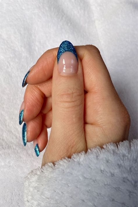 Colored French Tip Nails Winter, Sparkly French Tips Almond, Blue Nails Ideas Sparkle, Navy Glitter French Tip Nails, Blue Glitter French Tip Nails Almond, Blue Glitter Nails French Tip, Dark Blue Sparkly French Tip Nails, Navy Blue Glitter French Tip Nails, Monochromatic French Tip Nails