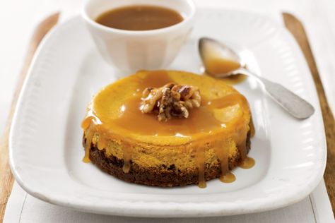 Pumpkin Cheesecake with Walnut-Ginger Crust and Caramel Sauce Recipe -- Yankee Magazine Walnut Cheesecake, Caramel Sauce Recipe, Walnut Crust, Cheesecake Crust, Caramel Recipes Sauce, Pumpkin Spice Syrup, Thanksgiving Food Desserts, Ginger Snap Cookies, New England Travel