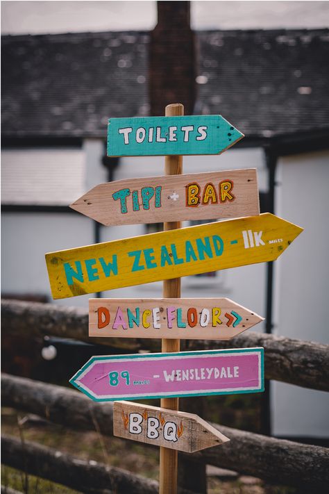 Beautiful DIY Bohemian Village Hall Wedding Wedding Signpost, Wooden Sign Posts, Christian Festival, Mood 2024, Festival Paint, Village Hall Wedding, Diy Bohemian, Bloom Photography, Helter Skelter