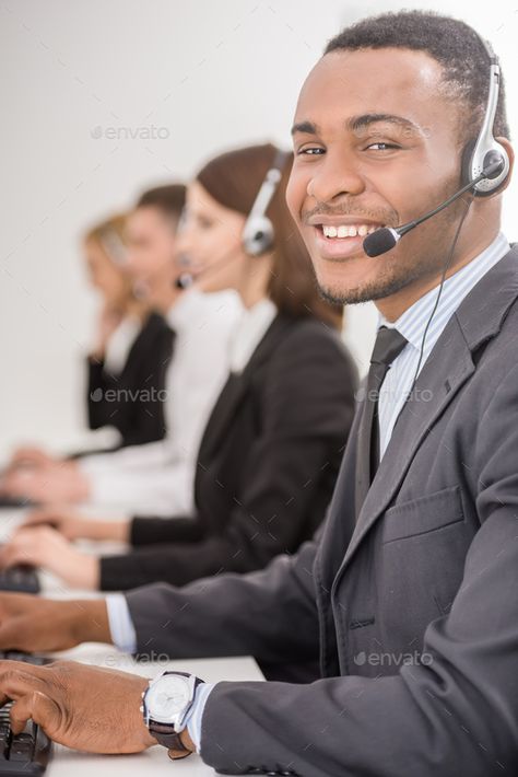 Call center by GeorgeRudy. Agent smiling while working on his computer with colleagues next to him. #Sponsored #GeorgeRudy, #Agent, #Call, #center Call Center Agent, Iphone Wallpaper Hd Nature, Mini Comic, Call Center, Business Man, Iphone Wallpaper, Computer, Iphone, Quick Saves