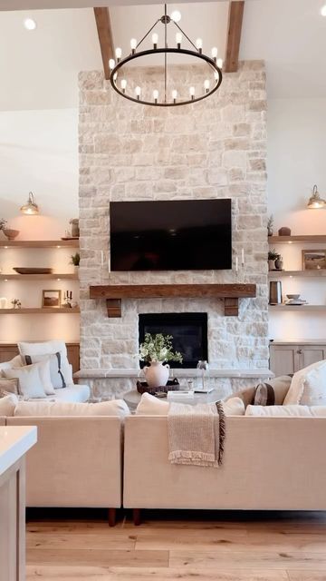 Fireplace Location Ideas, Stone Fireplace Beach House, Stone On White House Exterior, Texas Limestone Fireplace, Stone Wall In Living Room, White Stone Fireplace With Wood Mantel, White Washed Stone Fireplace, Brick Fireplace With Built Ins, Light Stone Fireplace