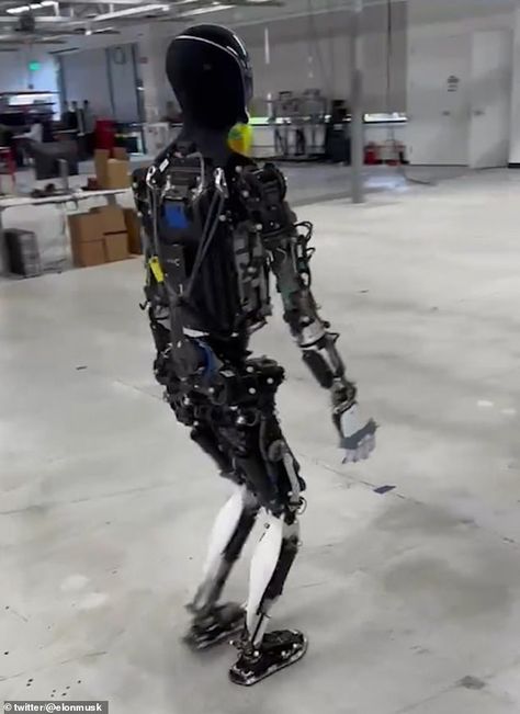 Elon Musk takes Tesla's creepy Optimus robot for a walk around the factory - as concerned viewers warn 'this isn't going to end well' | Daily Mail Online Elon Musk Robot, Elon Musk News, Elon Musk Starlink, Neurolink Elon Musk, Elon Musk Spacex, Elon Musk Tesla, Humanoid Robot, Us Presidents, Taking Over The World