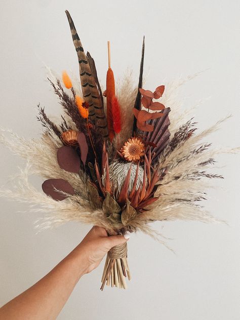 Fall bridal bouquet Dried flower bouquet Burgundy and Burnt orange wedding arrangement MEASUREMENTS: M size (Bridesmaid bouquet) Total height : 30 cm - 35cm (11,8 - 13,7 Inches) Total width: 15- 18 cm ( 5,9 - 7 Inches) L size ( Bridal bouquet) Total height : 35 cm - 43 cm (13,7 - 16,9 Inches) Total width: 18- 25 cm (7- 9,8 Inches) The price includes a bouquet only. Vases and other decor are not included. 🔘 SHIPPING INFO! The item will be shipped in 3-5 days after purchase. It takes about 10-21 Burgundy And Burnt Orange Wedding, Flower Bouquet Burgundy, Fall Wedding Bouquets Burgundy, Burgundy Bridal Bouquet, Floral Vase Arrangements, Orange Centerpieces, Fall Bridal Bouquet, Bouquet Burgundy, Burnt Orange Wedding