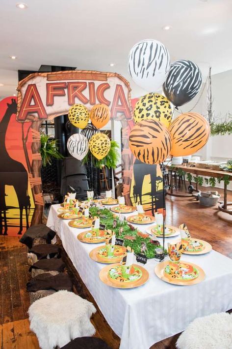 The table settings and party decorations at this African Safari 1st Birthday Party are so much fun! See more party ideas and share yours at CatchMyParty.com #catchmyparty #safaribirthdayparty #safari1stbirthdayparty #safari1stbirthdayparty #boybirthdayparty Africa Theme Party, Safari Birthday Party Ideas, Africa Party, Safari Party Decorations, Jungle Theme Birthday Party, Jungle Theme Birthday, Birthday Table Decorations, Safari Theme Birthday, Jungle Safari Party