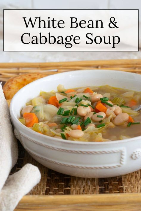 Bean and Cabbage Soup is the perfect balance of simple ingredients and big flavor. Ready in under an hour, this recipe makes for a satisfying meal that’s both nutritious and budget-friendly. Give it a try the next time you're craving something cozy. Cabbage And White Beans, Cabbage Bean Soup, Cabbage And Bean Soup, White Bean And Cabbage, Bean And Cabbage Soup, Easy Cabbage Soup, Ham And Cabbage, Cabbage Soup Recipe, Cabbage Soup Recipes