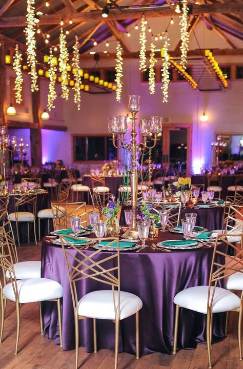 A Mardi Gras event with purple linened tables, gold chairs, and emerald green napkins. Mardi Gras Wedding Theme Receptions, Mardi Gras Themed Wedding, Mardi Gras Wedding Reception, Mardi Gras Table Centerpiece Ideas, Mardi Gras Gala, Mardi Gras Aesthetic, Mardi Gras Wedding Theme, Ball Themes, Mardi Gras Party Ideas